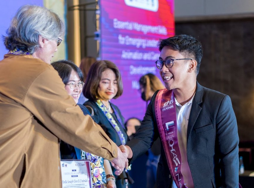 Abelle Patindol receiving recognition at an industry event